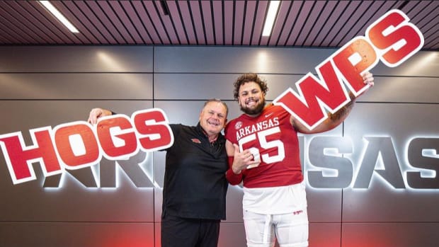 Coach Sam Pittman and transfer left tackle Fernando Carmona pose for picture as he commits on official visit.